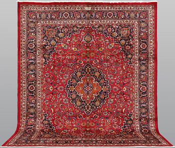 A signed Mashad carpet, ca 375 x 303 cm.