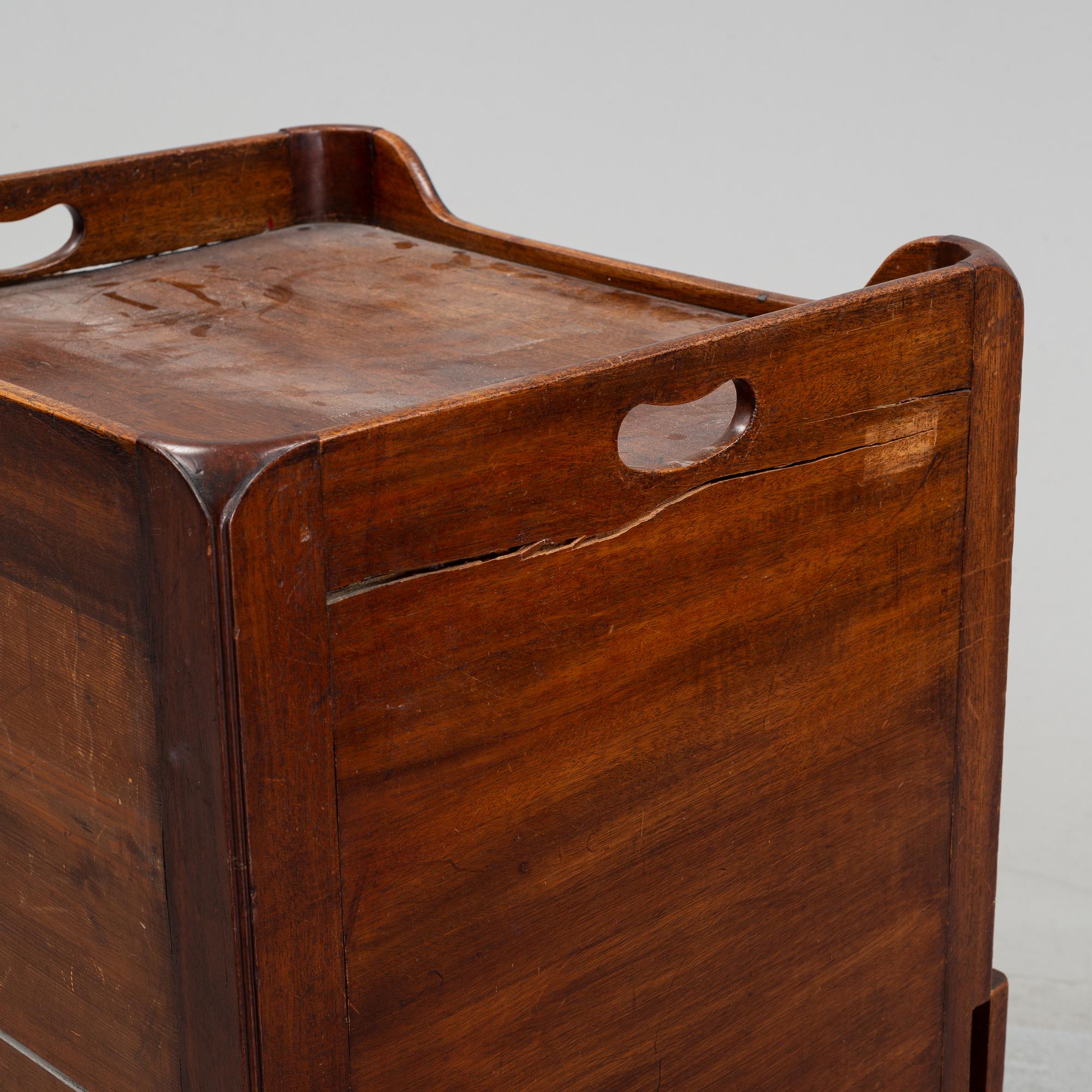 A mahogany bedside table, England, 19th century.