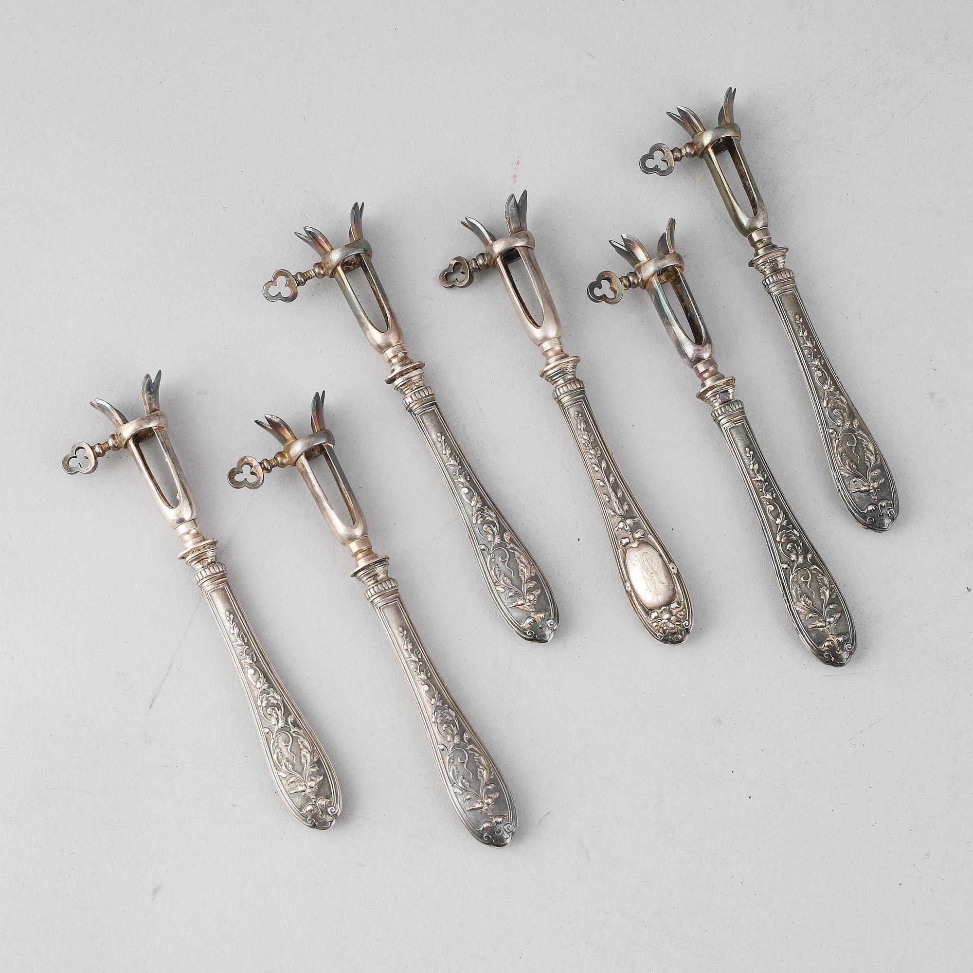 A set of six French 19th century silver bone-holders.