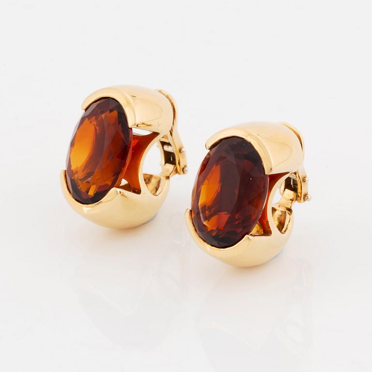 A pair of Tina Karlsson earrings in 18K gold set with faceted citrines.