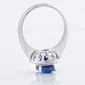 A sapphire and square cut diamond ring.