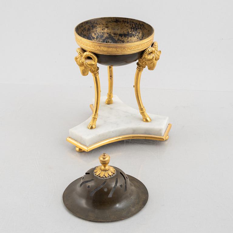 A French Empire ormolu and patinated bronze brûle-parfum, early 19th century.