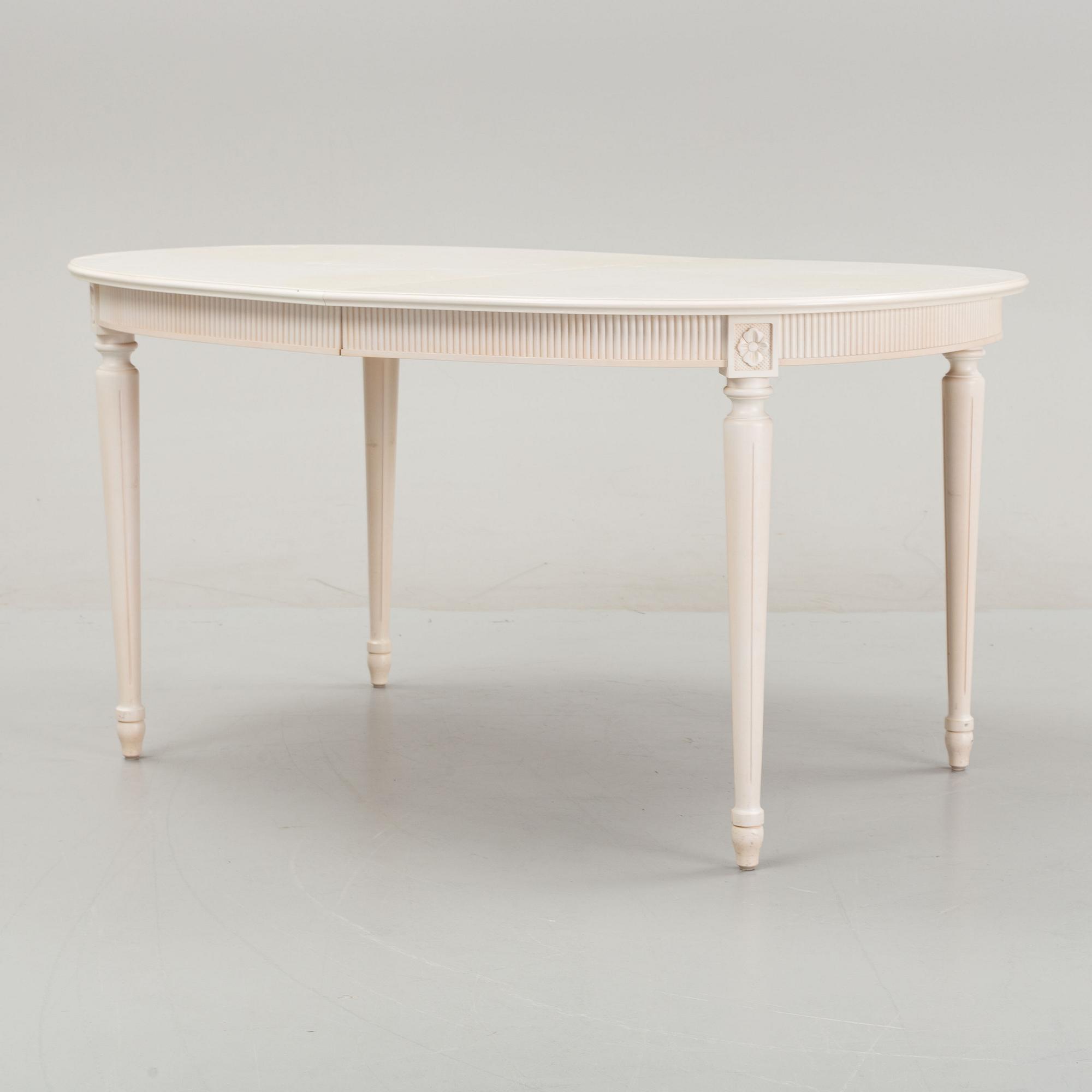 A dining table with eight chairs and a stool, Gustavian style, second half of the 20th Century.