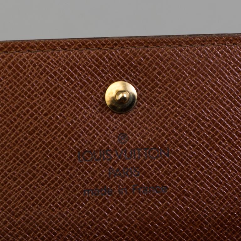 A wallet by Louis Vuitton.
