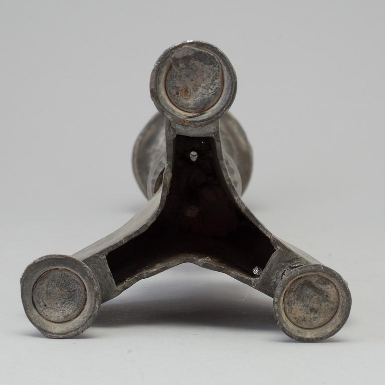 A 17th century pewter candlestick.