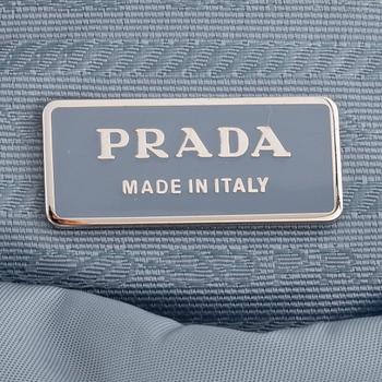 PRADA, a blue nylon crossbody bag.