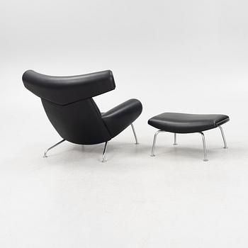 Hans J Wegner, an 'Ox Chair' and an ottoman, for Erik Jørgensen, Denmark, 2005 and 2010.