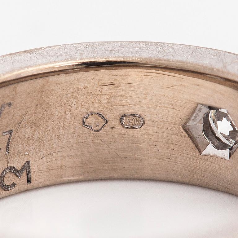 Cartier, an 18K white gold 'Love' ring with three brilliant-cut diamonds.