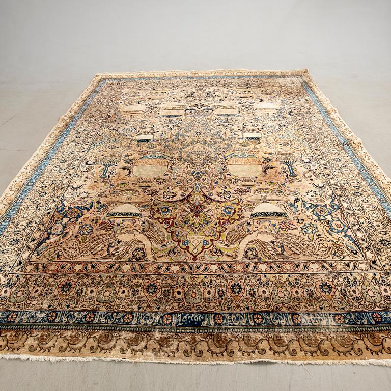 An antique Tabriz carpet, North West Persia, signed Akhondzadeh, c. 394 x 295 cm.