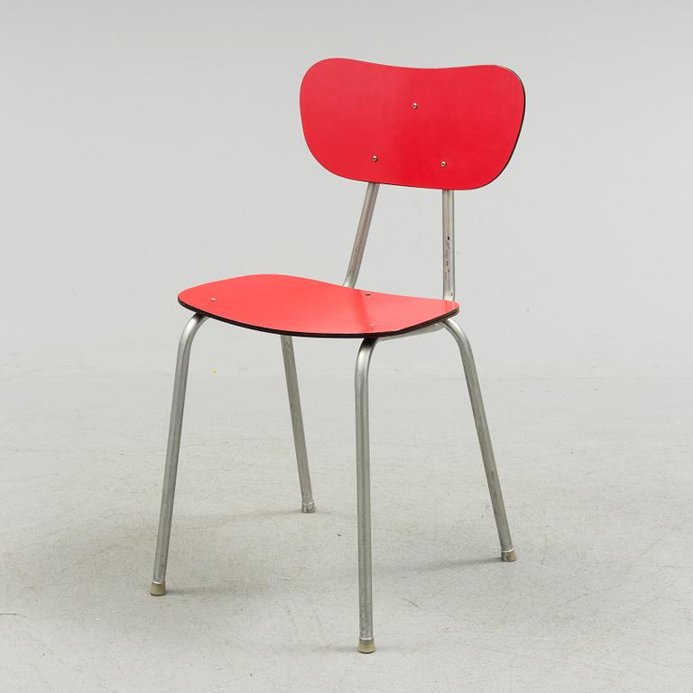 A mid 20th century table and chair.