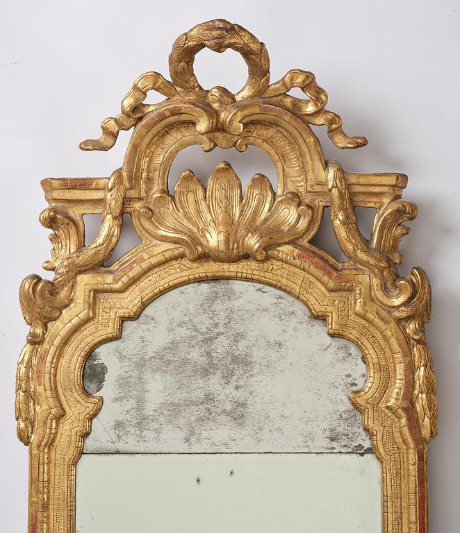 A Trasitional giltwood mirror by J. Åkerblad (master in Stockholm 1758-99).