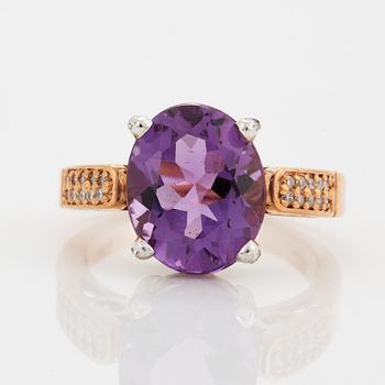 Oval faceted amethyst and brilliant-cut diamond ring.