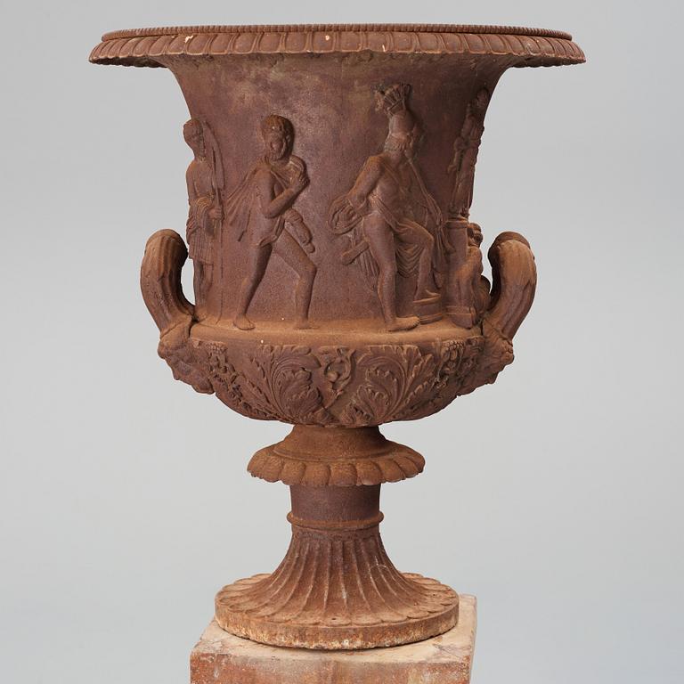 An around year 1900 iron garden Medici vase.