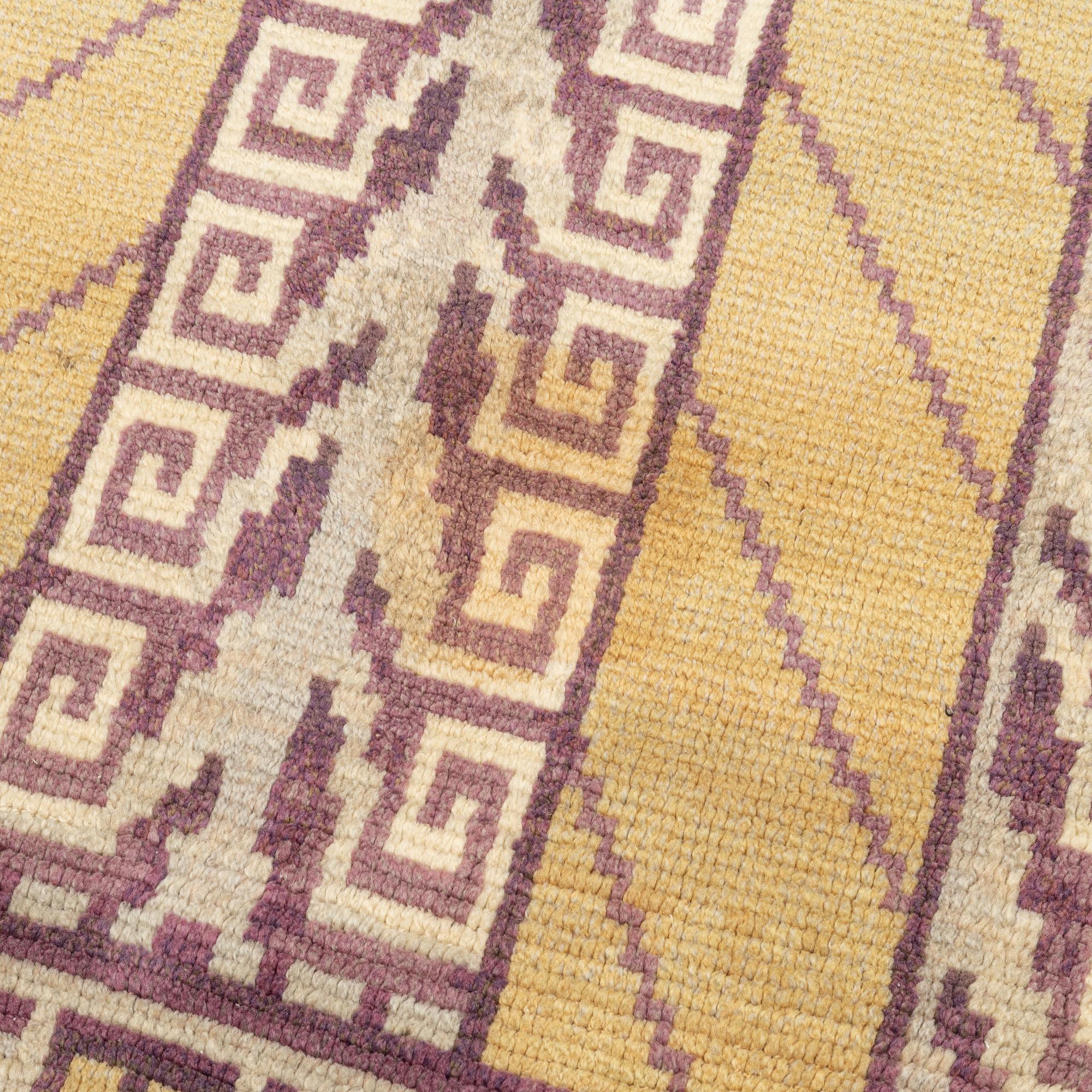 An Art Déco Pile Rug, 1930s. Circa 237 x 112 cm.