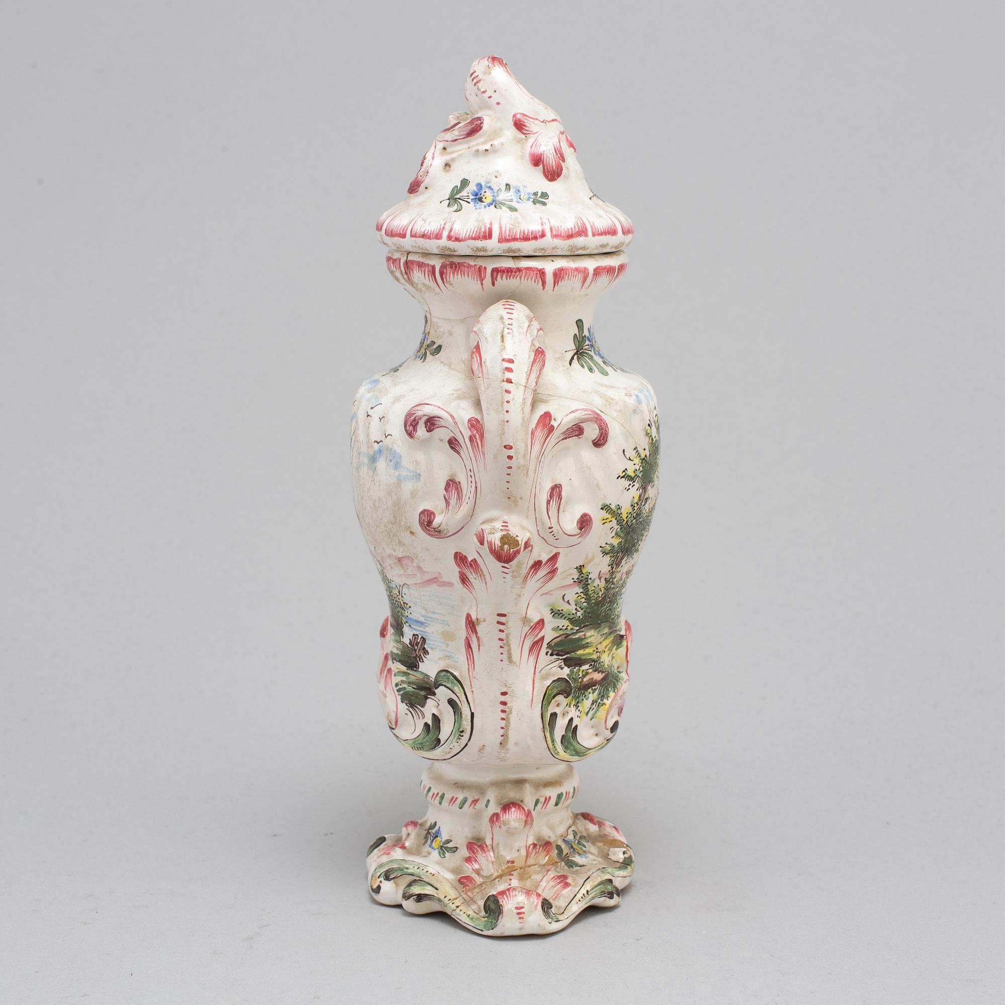 A Rococo faiance vase with cover, mid 18th century.