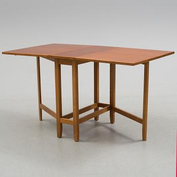 A mid 20th century flap table.