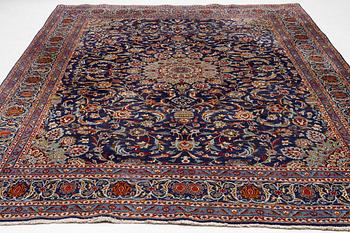 An oriental carpet, c. 390 x 295 cm.