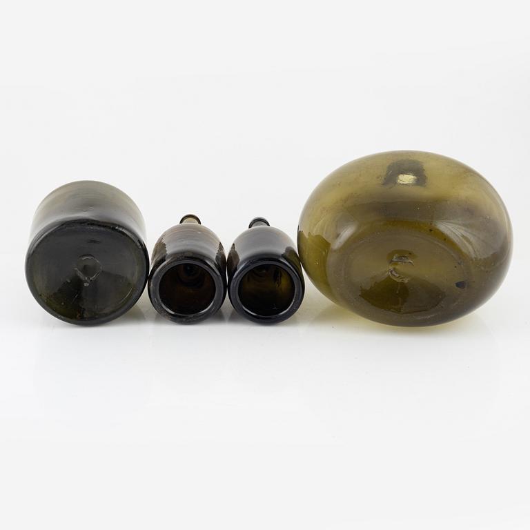 Four glass bottles, 18th/19th century.