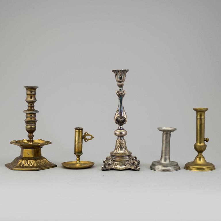 FIVE BRONZE, BRASS AND PEWTER CANDLESTICKS, 18th/19th century.