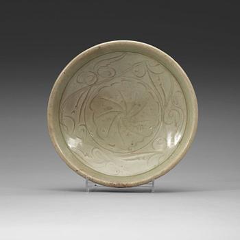 A carved celadon dish, Ming dynasty (1368-1644).