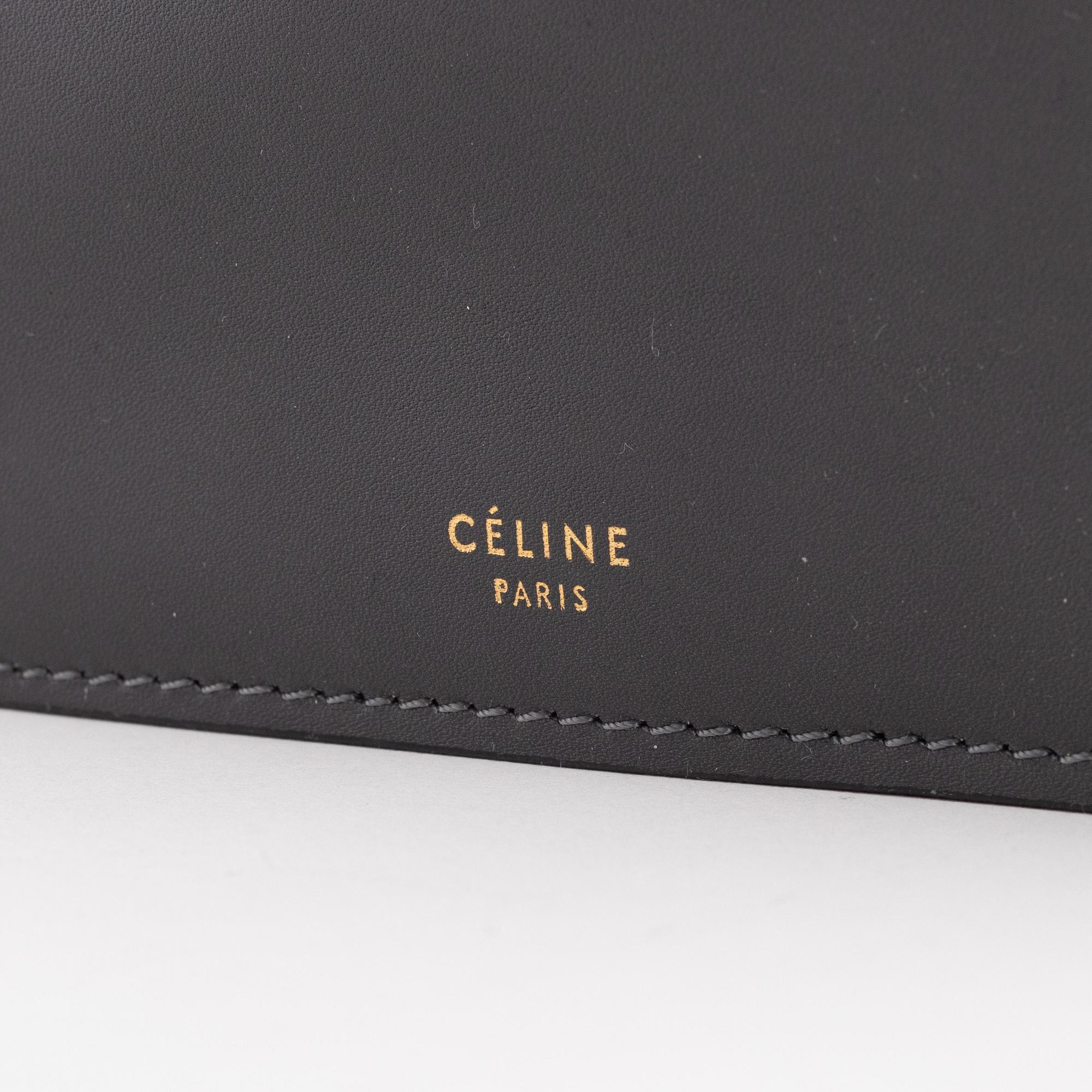 Céline, a grey leather handbag.