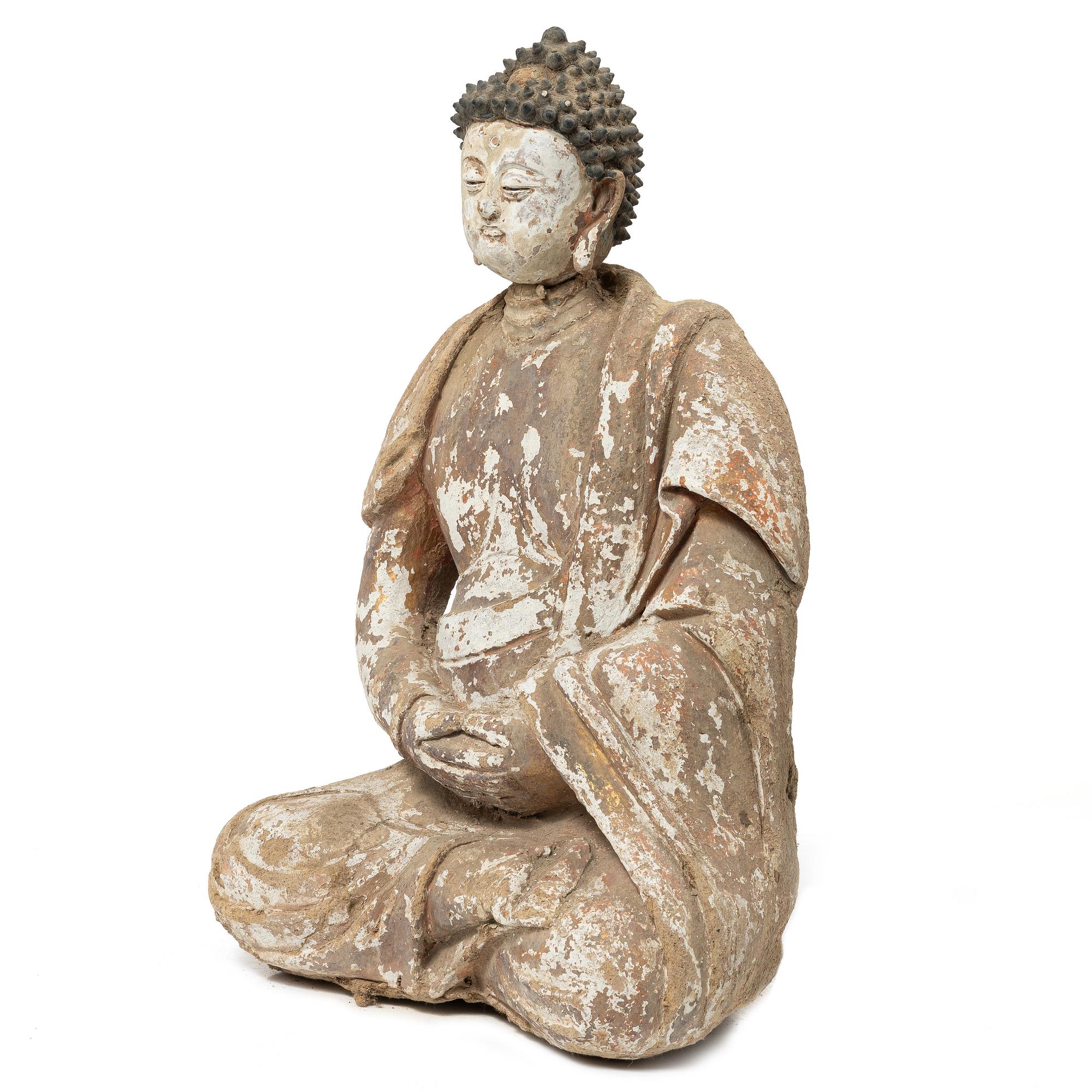 A Southeast Asian figure of a Buddha, 20th century.