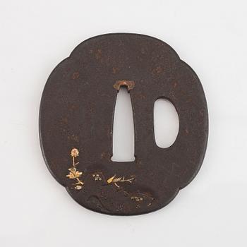 A Japanese iron Tsuba, Edo, 19th century, signed Yanagawa Naomasa.