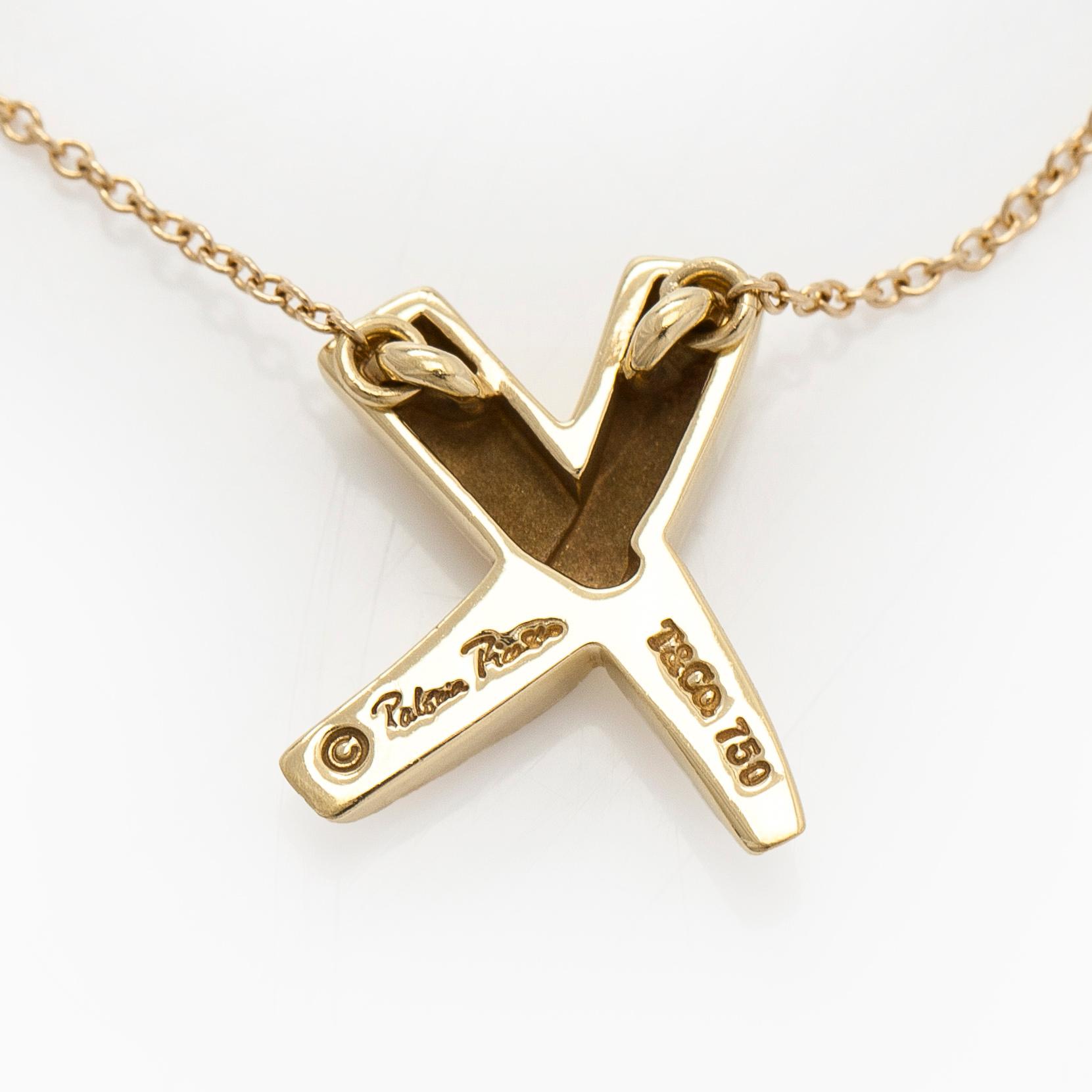 Tiffany & Co, Paloma Picasso, an 18K gold "X Kiss" necklace.