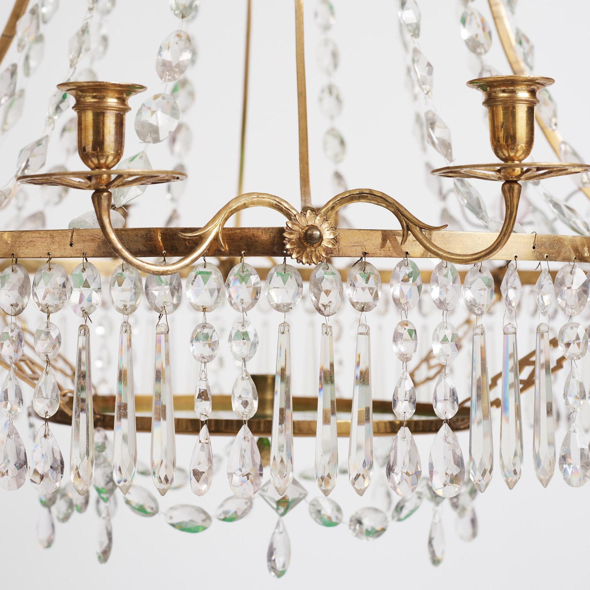 A German Louis XVI ormolu and cut-glass nine-light chandelier attributed to Johann Christoph Ermisch, late 18th century.