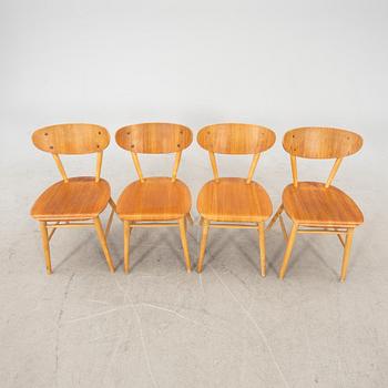 A set of four birch and teak veneered chairs from Bröderna Wigells stolfabrik, Malmbäck mid 20th century.