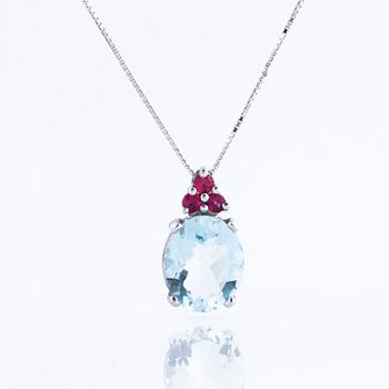 A aquamarine and ruby pendant.