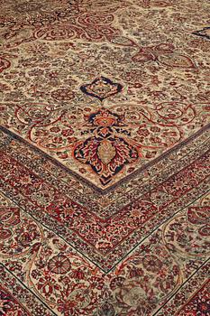 A carpet, an antique Kerman Laver, ca 677-688,5 x 510,5-526 cm.