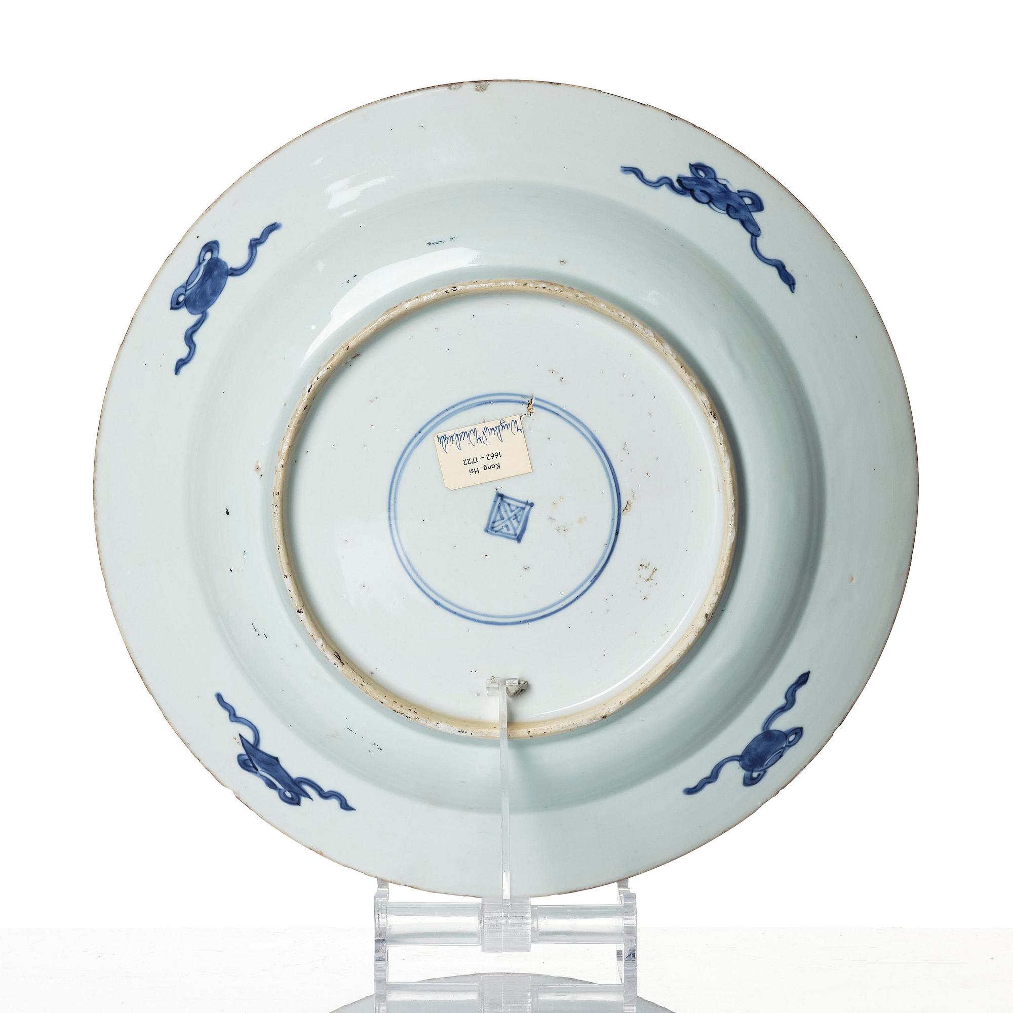 A blue and white 'reverse decorated' serving dish, Qing dynasty, Kangxi (1662-1722).