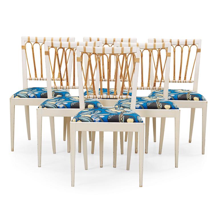 A set of six Josef Frank white lacquered wood and ratten dining chairs, Svenskt Tenn, model 1165.