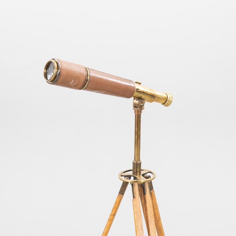 A brass and leahter tube binocular with stand around 1900.