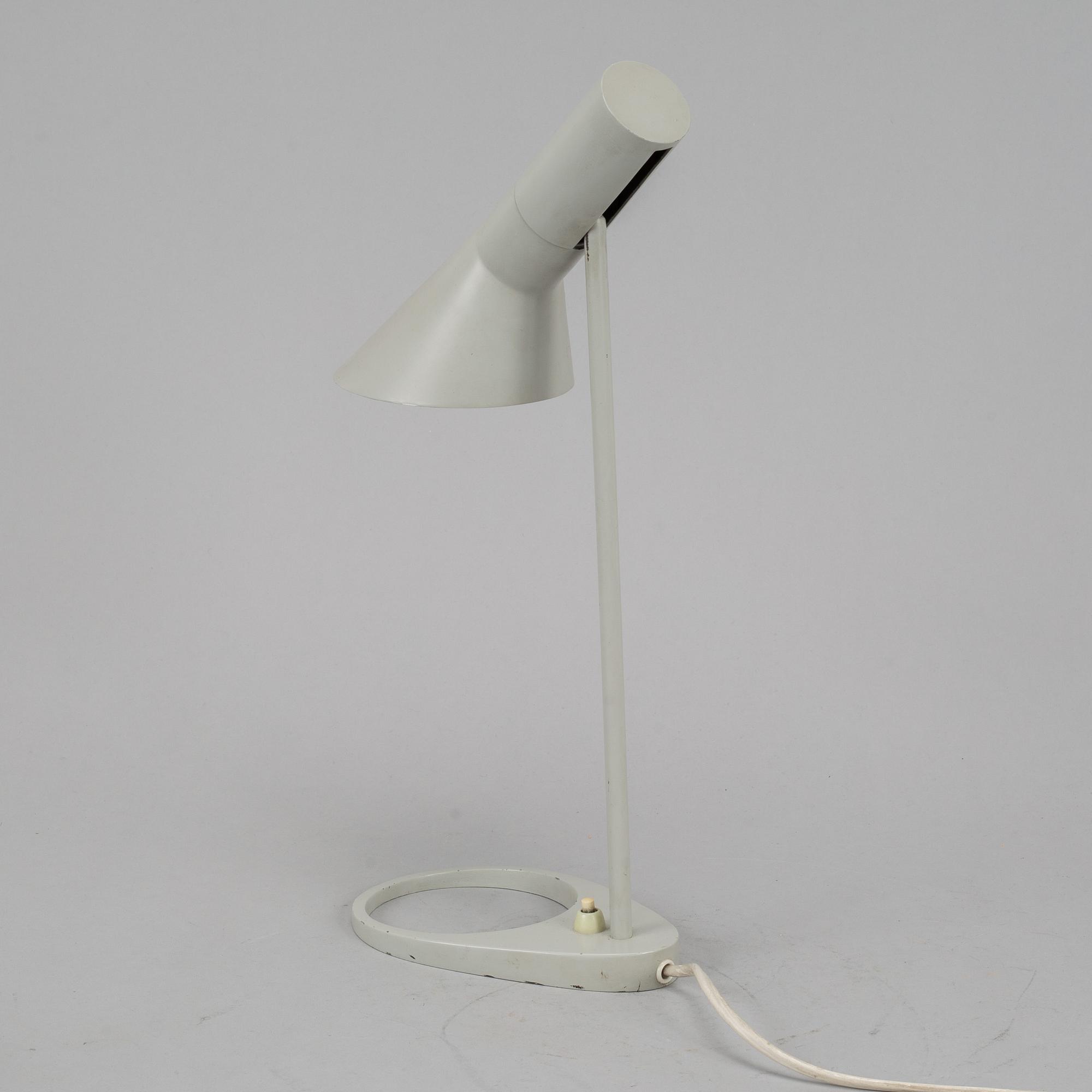 Arne Jacobsen, a grey lacquered 'AJ' table lamp for Louis Poulsen /by license Axel Annell.