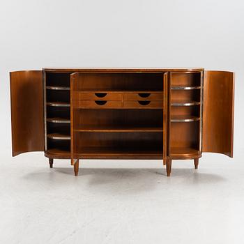 A 1940s mahogany veneered cabinet.