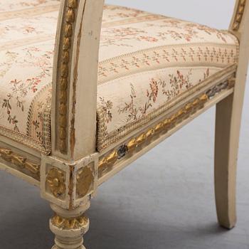 A pair of first half of the 19th century Empire arm chairs.