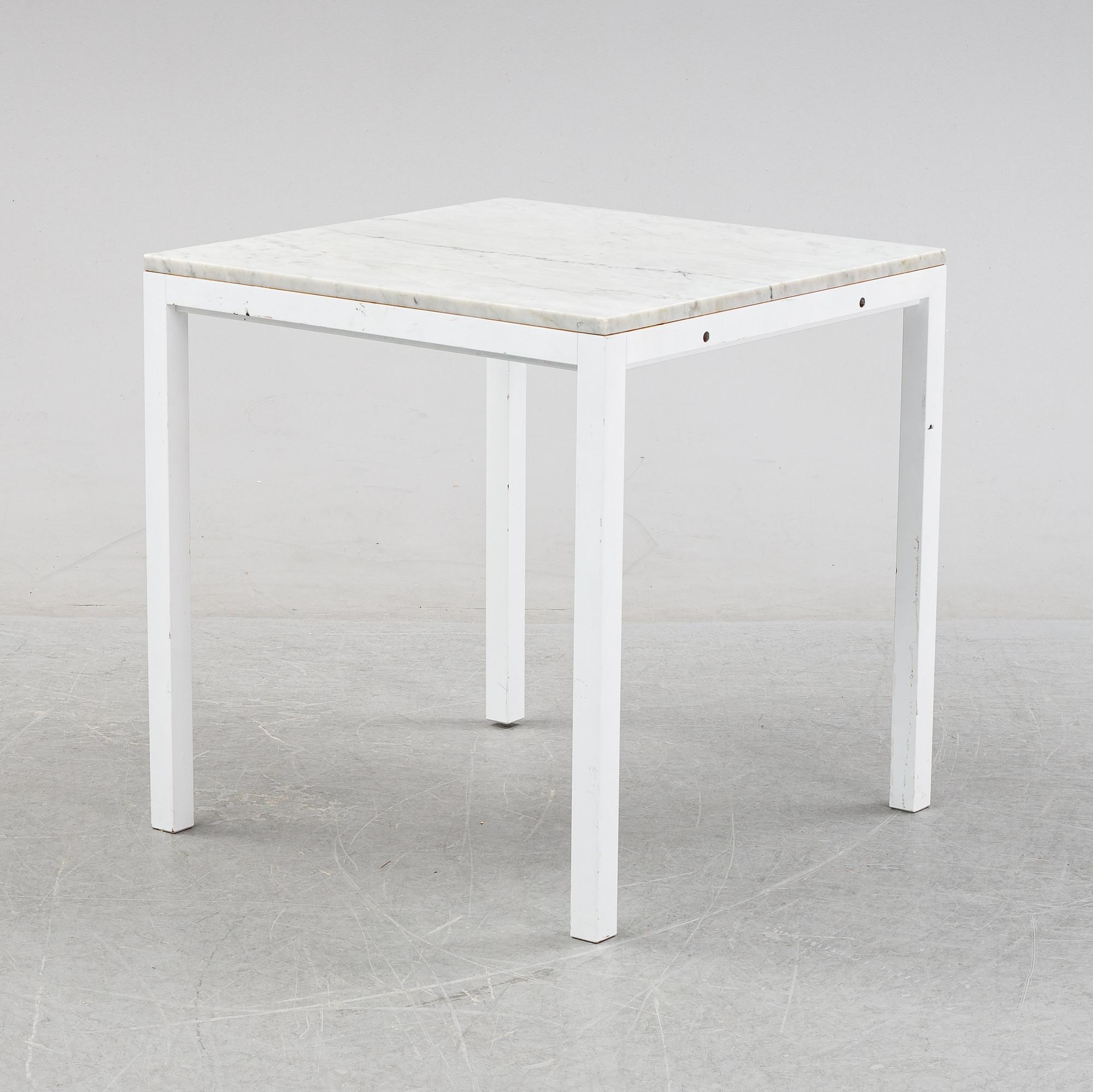 A marble top table, 21th century.