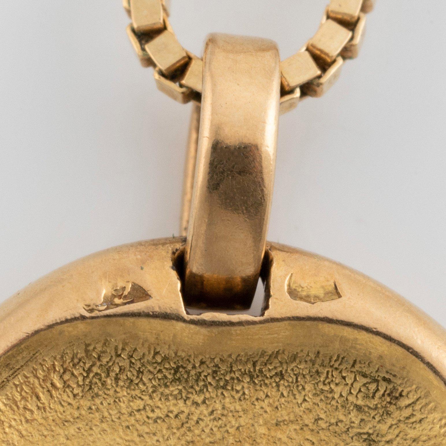 A Cartier Leo zodiac pendant.