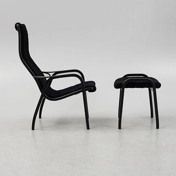 Yngve Ekström, a 'Lamino' armchair with stool, Swedese, Sweden, 2019.