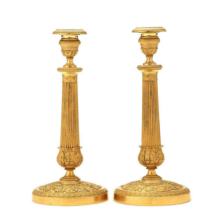 A pair of Empire early 19th century candlesticks.