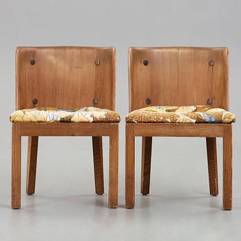 Axel Einar Hjorth, a pair of "Lovö" stained pine armchairs, Nordiska Kompaniet, Sweden 1930's.