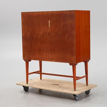 A mahogany veneered cabinet, 1940s/50s.