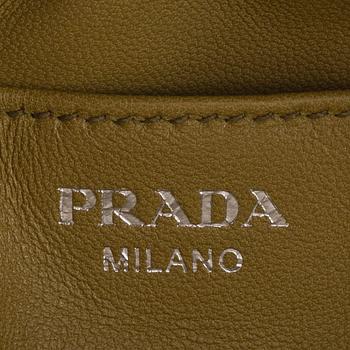Prada, a beige ostrich leather bag.