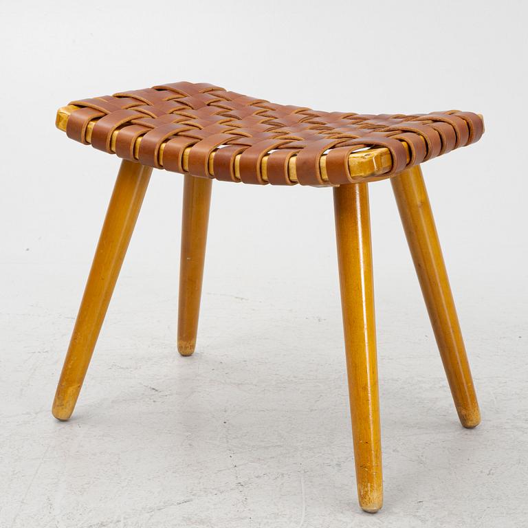 A mid 20th century birch stool with leather.