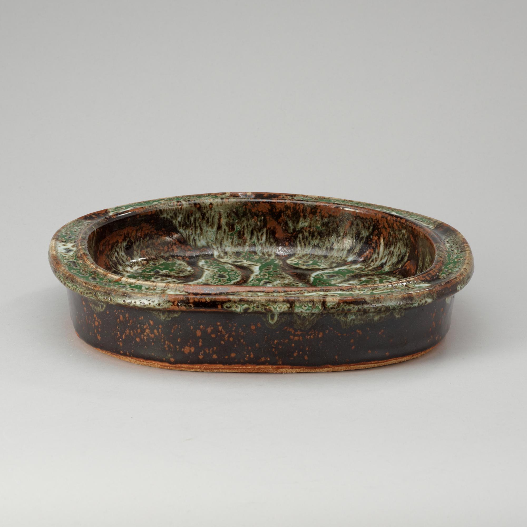 An Erik Pløen green and brown glazed stoneware dish, Norway.