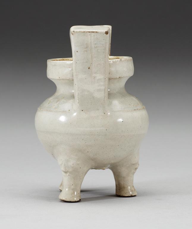 A pale grey-bluish glazed tripod censer with decor in relief, and archaistic mark, Ming dynasty (1368-1644).