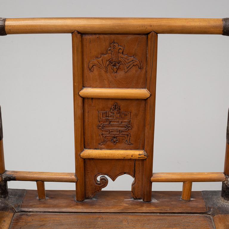 A pair of Chinese wooden armchairs, late 19th/early 20th century.