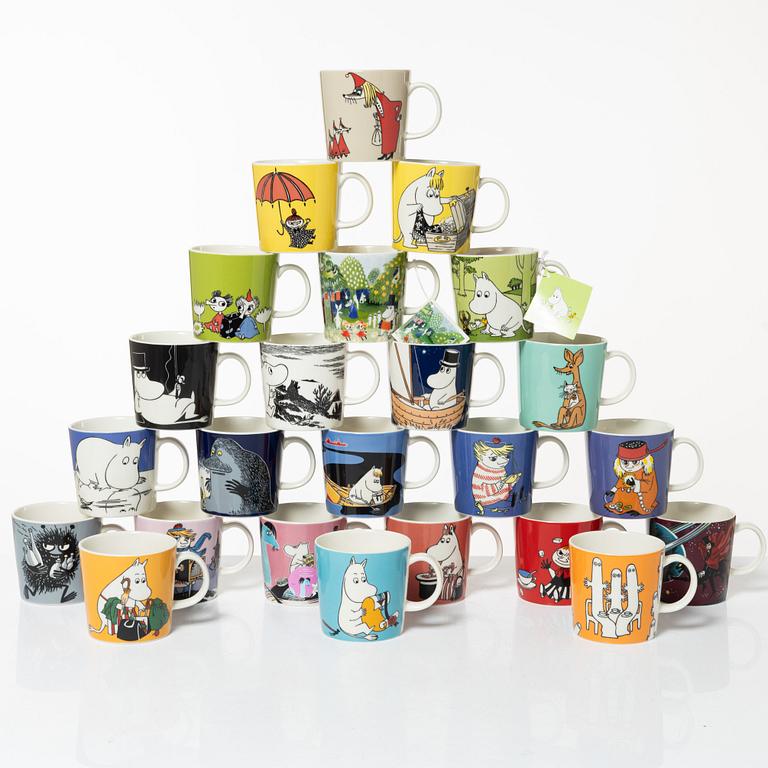 A set of 24 Moomin mugs, Arabia, Finland.